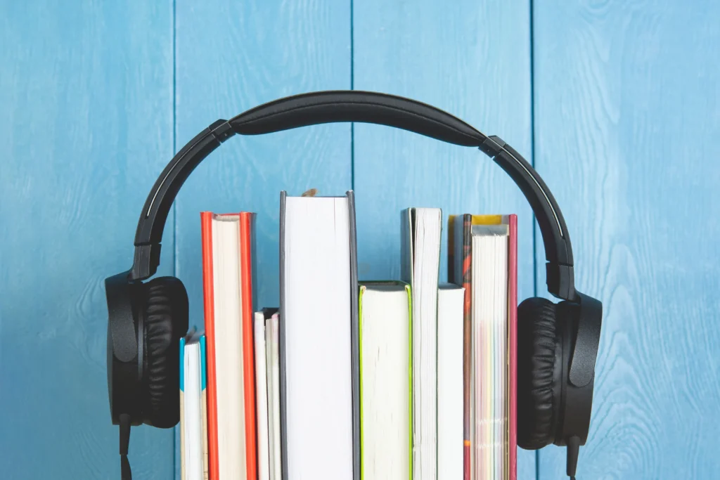 headphone-and-books-on-blue-background-audio-book